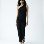Woman wearing a black one-shoulder dress on a white background